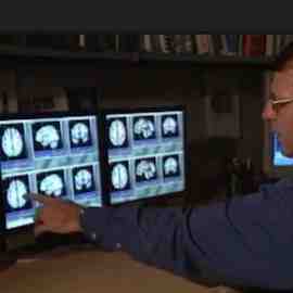 Radiologist reviewing brain MRI scans Radiologist reviewing brain MRI scans