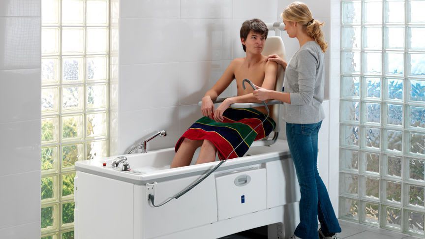 Electrical medical bathtub / with lift seat / height-adjustable Sovereign™ ArjoHuntleigh