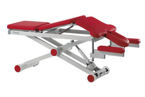 Electrical massage table / height-adjustable / on casters / 3 sections aXion Zimmer MedizinSysteme