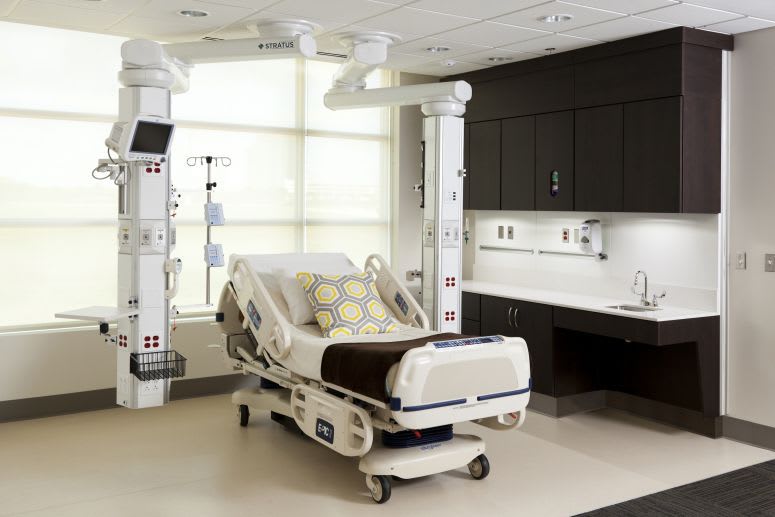 Ceiling-mounted medical pendant / articulated / with column Stratus™ Modular Services Company