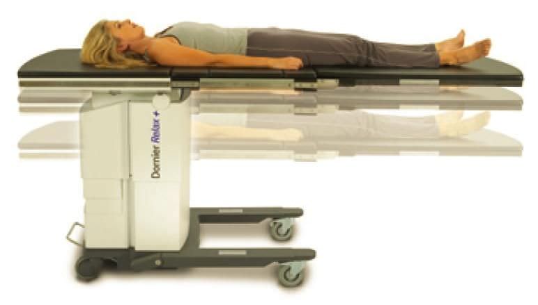 Urological examination table / electrical / on casters / folding Relax + Dornier MedTech Europe