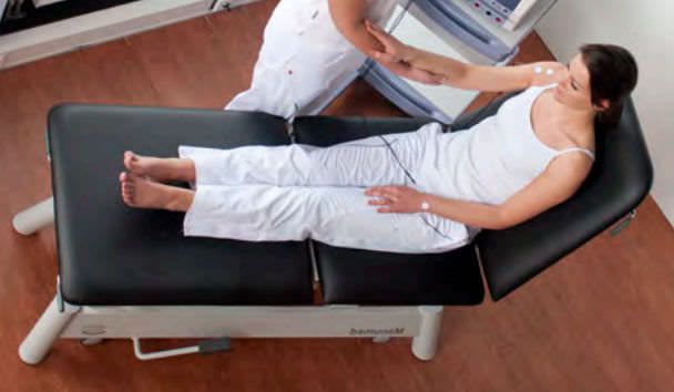 Electrical massage table / hydraulic / height-adjustable / on casters Manumed Comfort Enraf-Nonius